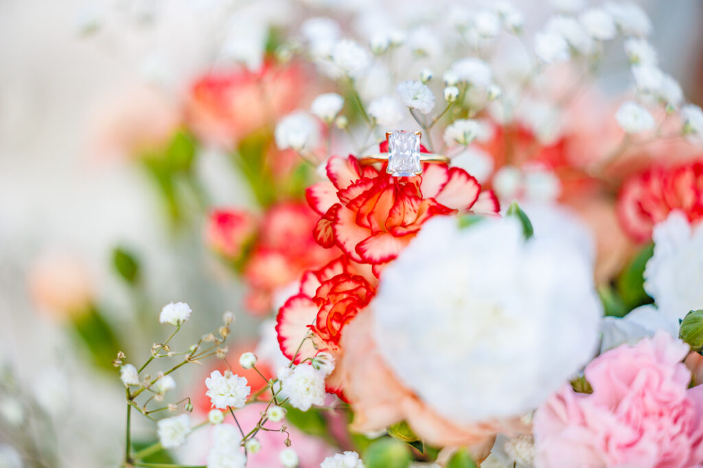 Bride in a white lace wedding gown holding a pastel bouquet at Carrollock Farms, a rustic barn wedding venue near Raleigh, North Carolina