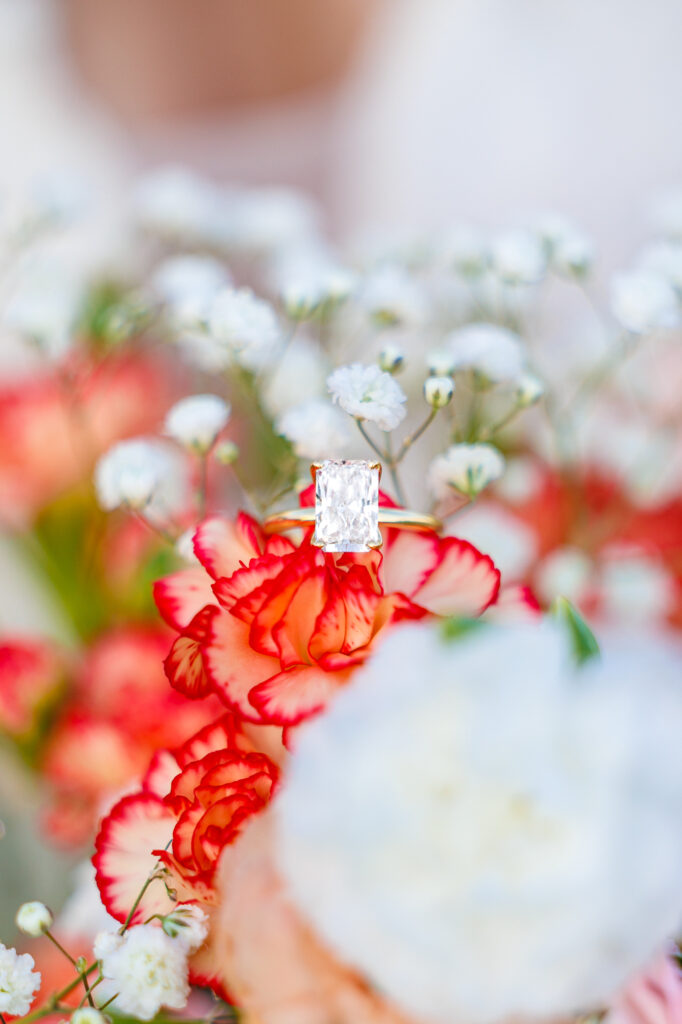 Bride in a white lace wedding gown holding a pastel bouquet at Carrollock Farms, a rustic barn wedding venue near Raleigh, North Carolina